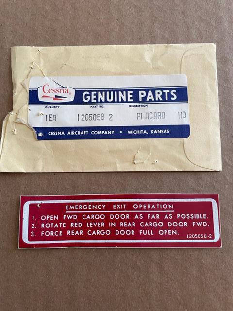Cessna 205, 206, 207 Cargo Door Emergency Exit Placard. New Old Stock - part number 1205058-2