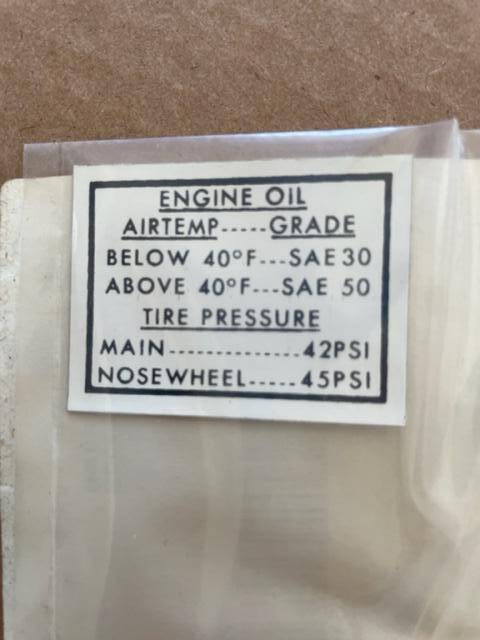 Cessna 210 Map Compartment Engine Oil And Tire Pressure Decal. New Old Stock